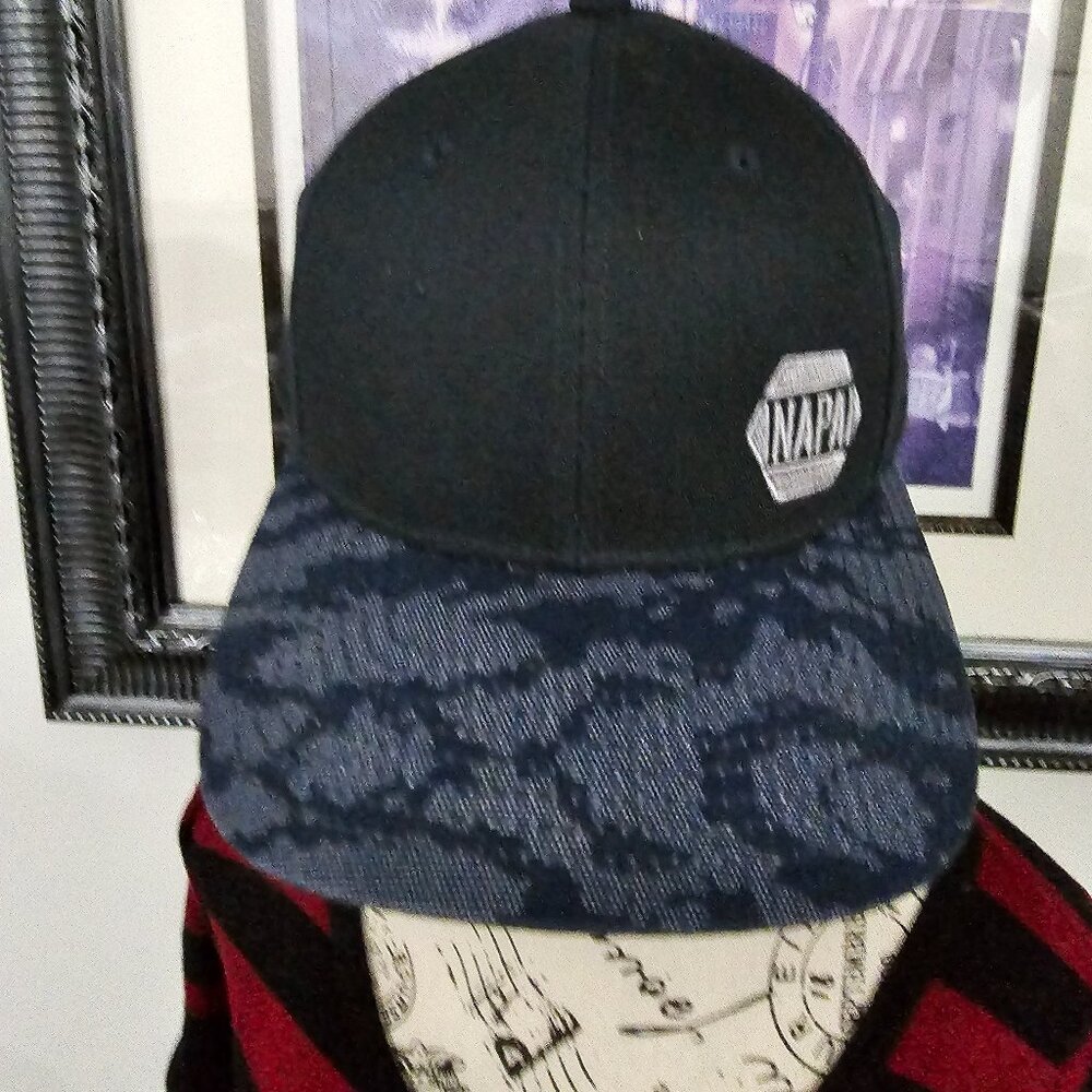 Napa Hat Napa Crest on front camouflage brim One size fit all Black in color